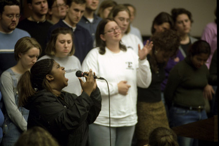 Crystal Taylor and the Gospel Choir lead students in worship at the service for the September 11 memorial environmental installation.