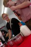 Danielle Blackstone and Kent Willis make ice cream for a Boys and Girls Club meeting, where students from the physics, chemistry and engineering departments gave presentations.  - Photo by Neisha Fuson