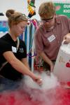 Danielle Blackstone and Kent Willis make ice cream for the children at a Boys and Girls Club.  - Photo by Neisha Fuson