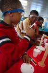 Children at a Boys and Girls Club enjoy playing with and learning about science when some Union students went to share their knowledge of physics, chemistry and engineering.  - Photo by Neisha Fuson