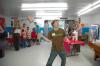 Nathan Brewer displays some basic physics principles to some children at a Boys and Girls Club.  - Photo by Neisha Fuson