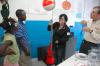 Michelle Thornhill and David Ward, professor of physics, show some children at a Boys and Girls Club some basic physics principles.  - Photo by Neisha Fuson