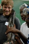 Dustin Scott smiles as children from a Boys and Girls Club ask all sorts of questions about his snake.
 - Photo by Neisha Fuson
