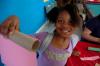 A girl from a Boys and Girls club shows her beginnings of a paper towel rocket.  - Photo by Neisha Fuson