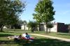 Sarah Brubaker and Hannah Williams sit outside with some friends as they enjoy the last few days of warm weather before the fall season comes. - Photo by Stephanie Schroeder