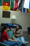 Senior Jasmine Huang and M.A.I.S. Student Ariane Mansur chat in the international lounge.  - Photo by Neisha Fuson