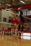 Juniors Jennifer Martins and Brisa Berlin block a hit by Martin Methodist College (Tenn.). - Photo by Stephanie Schroeder