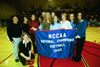 The Union softball team accepts their banner, which will be hung in the gym, as 2003 National Softball Championshiop winners. - Photo by Jim Veneman