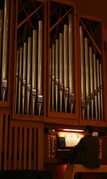 Ron Boud, professor of music, plays the organ for a chapel service.