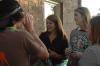 Sally Goulooze and friends chat while at the Chi Omega party for the Make-A-Wish Foundation. - Photo by Neisha Fuson