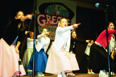 Chi Omega performs a number from <i>Grease</i> at All-Sing during Homecoming 2003.