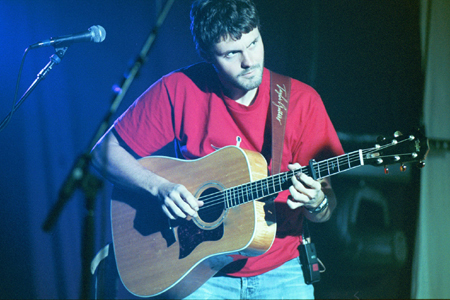 Gabe Scott plays the acoustic guitar with Bebo.