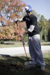 SAE Corbit Franks rakes leaves at the Augustine School during Day of Remembrance. - Photo by Kyle Kurlick