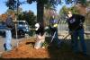 Freshmen Rachel Pettigrew, Leila Lawrence, Cherish Copper, and Elizabeth Wainscott lay mulch down on flower beds and around trees at Whitehall Elementary School during Day of Remembrance. - Photo by Stephanie Schroeder