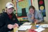 Sophomore Katherine Carr and Freshman Kasey Wilkinson color pictures for a teacher's lesson at Whitehall Elementary School during Day of Remembrance. - Photo by Stephanie Schroeder