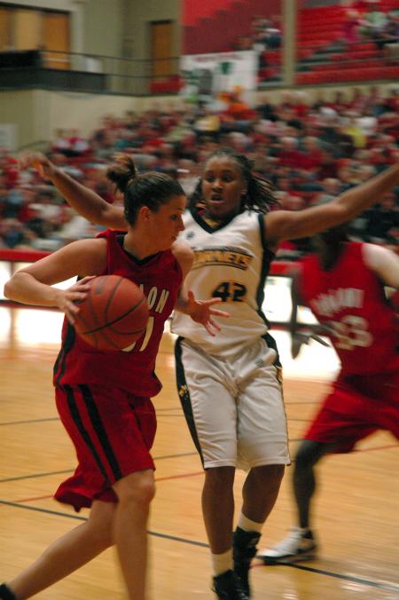 Junior Merideth Richardson Jacobs drives past defenders in Union's win over Harris-Stowe State College (Mo.). 