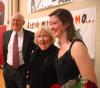 Sophomore Kelly Reed and her grandparents pose for some pictures during the Homecoming halftime.  - Photo by Neisha Fuson