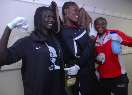 Members of the Lady Bulldog basketball team play around in front of the camera in between their cleaning duties at J-Crib Ministries during Day of Remembrance. 