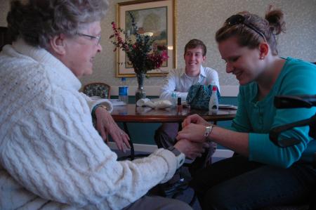 Junior Sarah Eastin and sophomore Ben Peacock visit with residents of Cheyenne Trace on Day of Remembrance. 