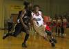 Sophomore guard Tacuma Alexander drives to the basket against a Campbellsville Univeristy (Ky.) defender in the Union's Homecoming victory. - Photo by Matthew Diggs