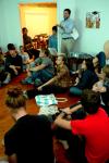 Taylor Worley lectures on Damien Hirst, star of the Young British Artists, in a weekly gathering of the Society for Critical Imagination. - Photo by Matt Elia