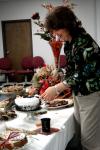 Patti Todd cuts a piece of cake at the School of Education's homecoming reception. - Photo by Kristi McMurry