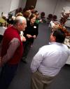 Ann Singleton and Ken Newman talks with alumnus John Gross and others at the School of Education's homecoming reception. - Photo by Kristi McMurry