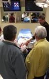 Mark Kossick describes the new simulation technology during a tour of the simulation lab at the School of Nursing's homecoming reception. - Photo by Kristi McMurry