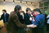 Graduate Jonathan Gillette (left) congratulates his uncle Roger Sullivan on a successful show. - Photo by Jim Veneman