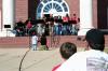 Blake Ward and his son of Jackson enjoyed watching the reunion band play in front of Jennings Hall during Homecoming's Arts in the Park. - Photo by Kristi McMurry