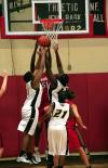 Union junior Josephine Owino fights for a rebound. - Photo by Kristi McMurry