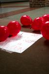 Balloons were placed outside of Coburn and the Lexington Inn with strips of paper inside telling students to visit the AIDS awareness booth to find out how they can help the cause.   - Photo by Kristi McMurry