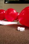Balloons were placed outside of Coburn and the Lexington Inn with strips of paper inside telling students to visit the AIDS awareness booth to find out how they can help the cause.   - Photo by Kristi McMurry