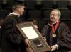 President Dockery presents the Doctor of Humanities award to Stephen C. Reynolds at December Graduation. - Photo by Jordan Buie