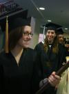Senior Class President Jill Casey leads the way as Art graduate Heather Couch and the Fall 2007 graduates follow her in the processional. - Photo by Stephanie Schroeder