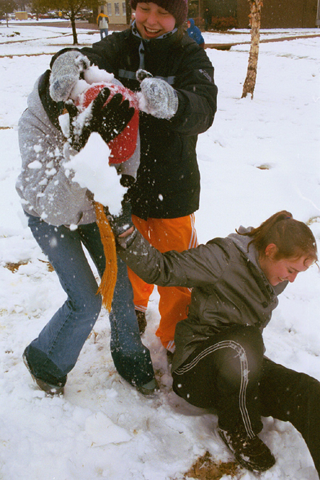 Freshmen Beth Pierce, Jill Hickman, and Cindy Keegan have fun playing in the snow.