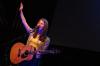 Worshipping during the benefit concert, Bethany Dillon raises a hand to the Lord.   - Photo by Neisha Fuson