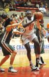 Junior Josephine Owino drives the lane during the first round of the NAIA national tournament. - Photo by Morris Abernathy