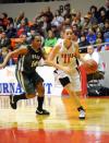 Kaitlin Dudley goes in for a layup in the first round of the NAIA national tournament. - Photo by Morris Abernathy