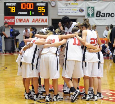 The Lady Bulldogs pray after defeating The Master's College (Calif.) during the second round of the NAIA national tournament.  They won 95-78.