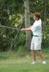 Tyler Lay follows through after chipping from the rough. - Photo by Steven Aldridge