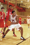 Junior Derrick Underwood looks for assistance from his teammates while cornered by Martin Methodist. - Photo by Justin Veneman