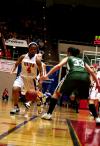 Jessica Graves dribbles past her University of Science and Arts opponent during the opening round of the NAIA Division I Women's Basketball National Championship at Oman Arena.  The Lady Bulldogs won the game 95-66. - Photo by Kristi McMurry