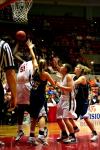 Josephine Owino goes up for a shot while her opponents try desperately to block her.  The Lady Bulldogs defeated The Master's during the second round of the NAIA tournament. - Photo by Kristi McMurry