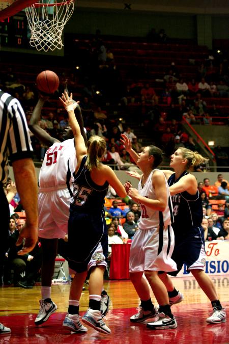 Josephine Owino goes up for a shot while her opponents try desperately to block her.  The Lady Bulldogs defeated The Master's during the second round of the NAIA tournament.