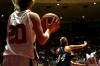 Kayla Hudson prepares to throw the ball in to Zeinab Chan who is being guarded during the second round NAIA game against The Master's. - Photo by Kristi McMurry
