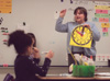 Assignment: Alison Oshel/Student Teacher - Working on telling time is a large aspect of what Oshel
teaches her first grade class during a math lesson. - Photo by Lindsay Stavish