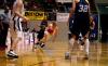 Kayla Hudson drives the ball past her opponents during the second round of the NAIA tournament against The Master's. - Photo by Kristi McMurry
