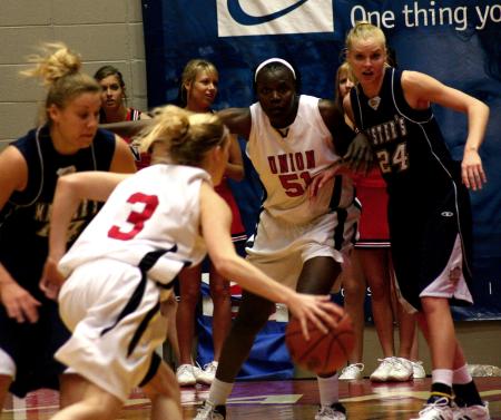 Crystal Eason makes a drive to the basket during the second round game of the NAIA tournament against The Master's.