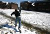 Snow covered Union's campus the night of Mar. 7, and students took a break from studying to play in it. Sophomore Matt Kuchem throws a snow ball in McAfee's courtyard. - Photo by Stephanie Schroeder